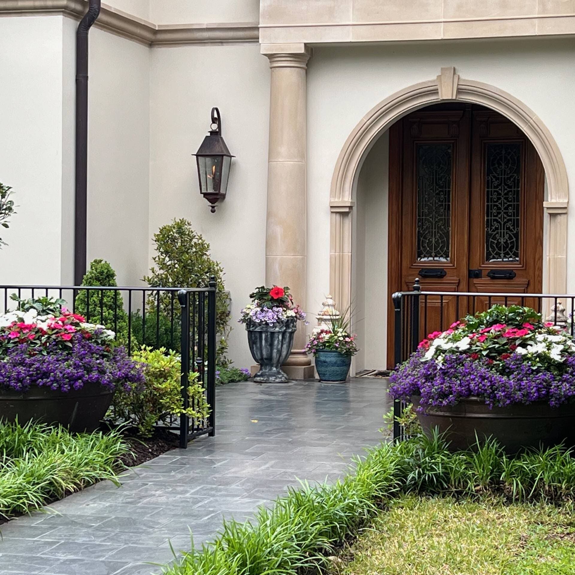 Spring Slate Tile Entry, Color Pots, Wrought Iron Fence, Hibiscus, Sunpatiens, Alyssum
